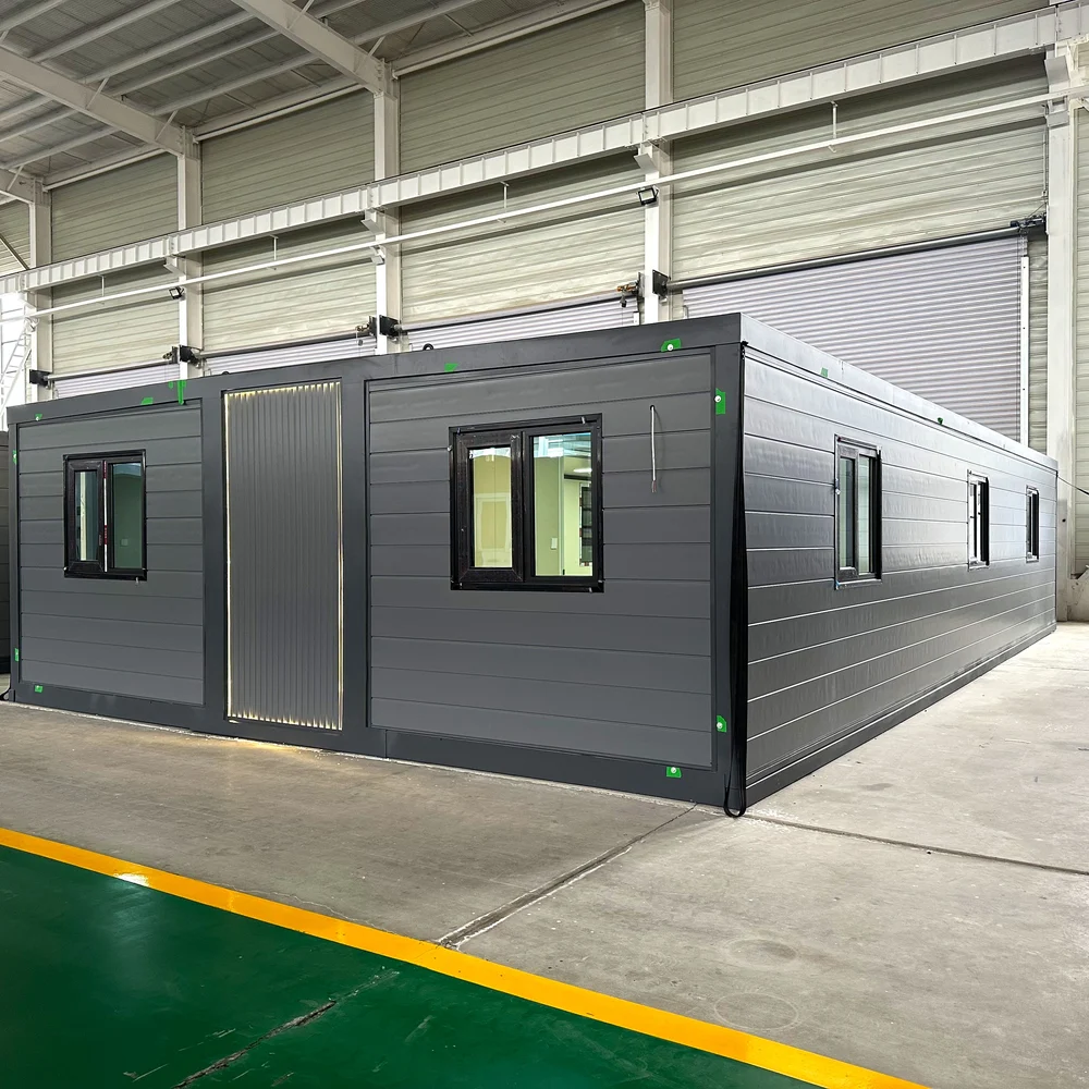 Grey expandable home with dark framing and several windows along its long side.