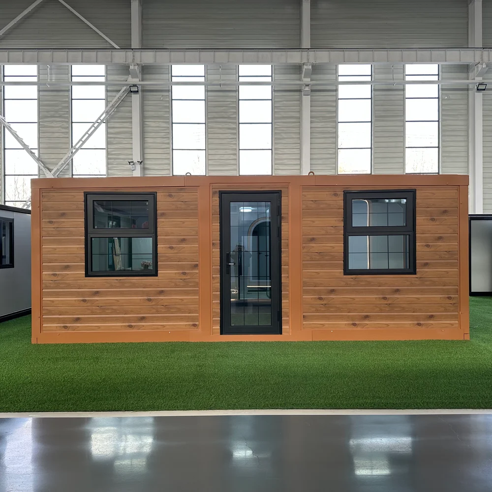 Wood-look expandable home with a central glazed entrance and dark-framed windows on each side.