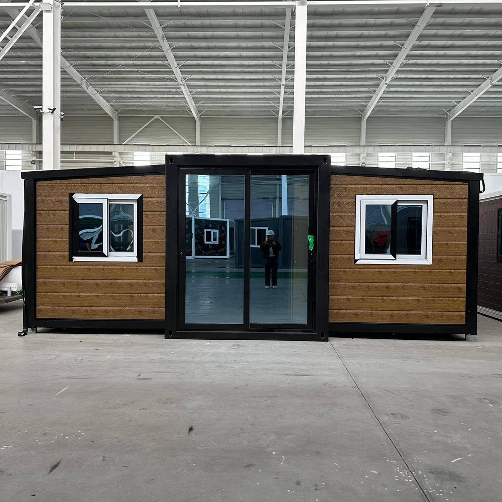 Wood-look front — dark entrance Wood-look front elevation with a tall dark-framed glazed entrance and light window frames.