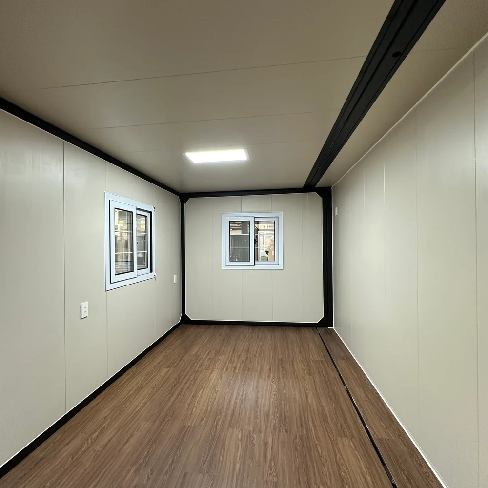 Qinbo Modern 30 — Unfurnished room — two windows Unfurnished room with two windows, light wall panels and brown wood-look flooring.