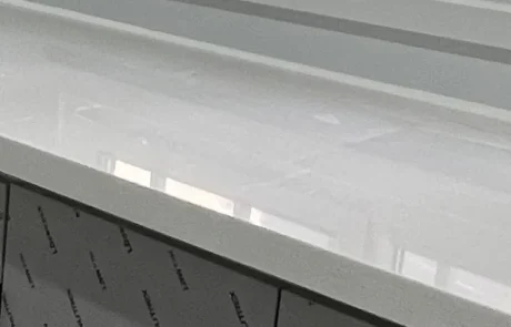 Close-up of a pale quartz kitchen worktop and its finished front edge.