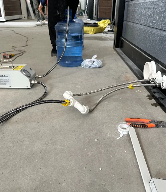 Water-pressure testing equipment connected to the plumbing.