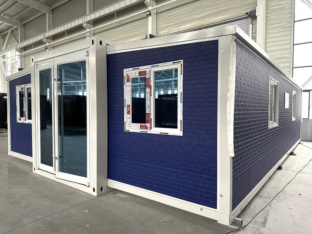 Expandable home with blue exterior and small brick effect finish, EX-M07