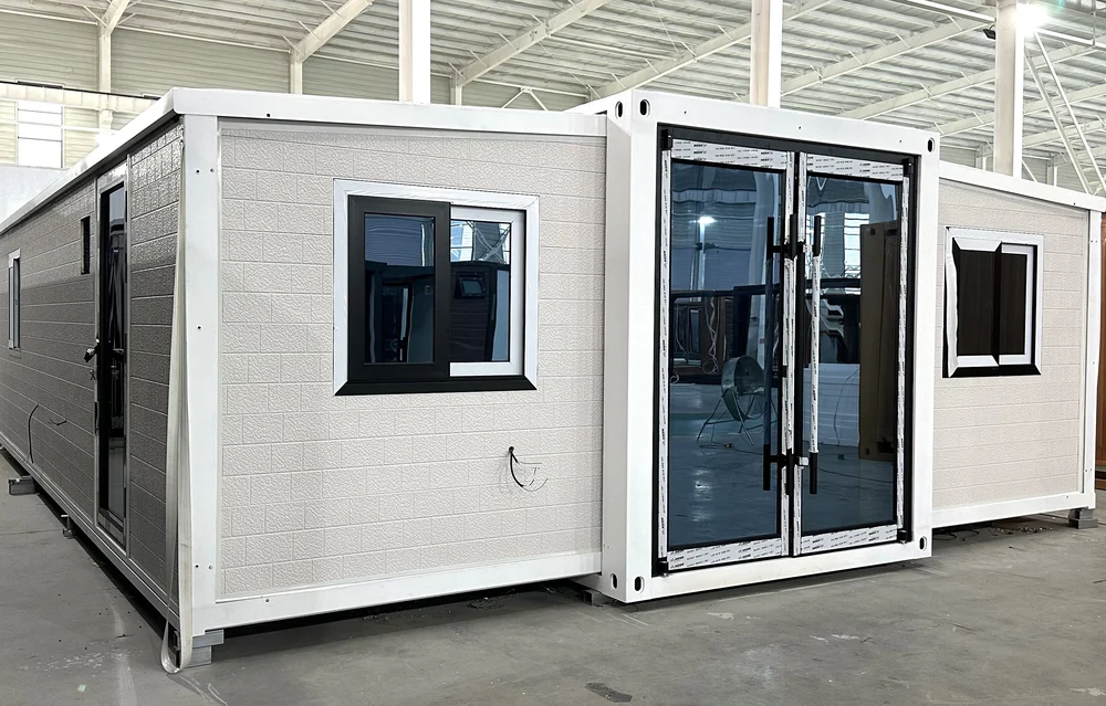 Expandable home with white exterior and large brick effect finish, EX-M09